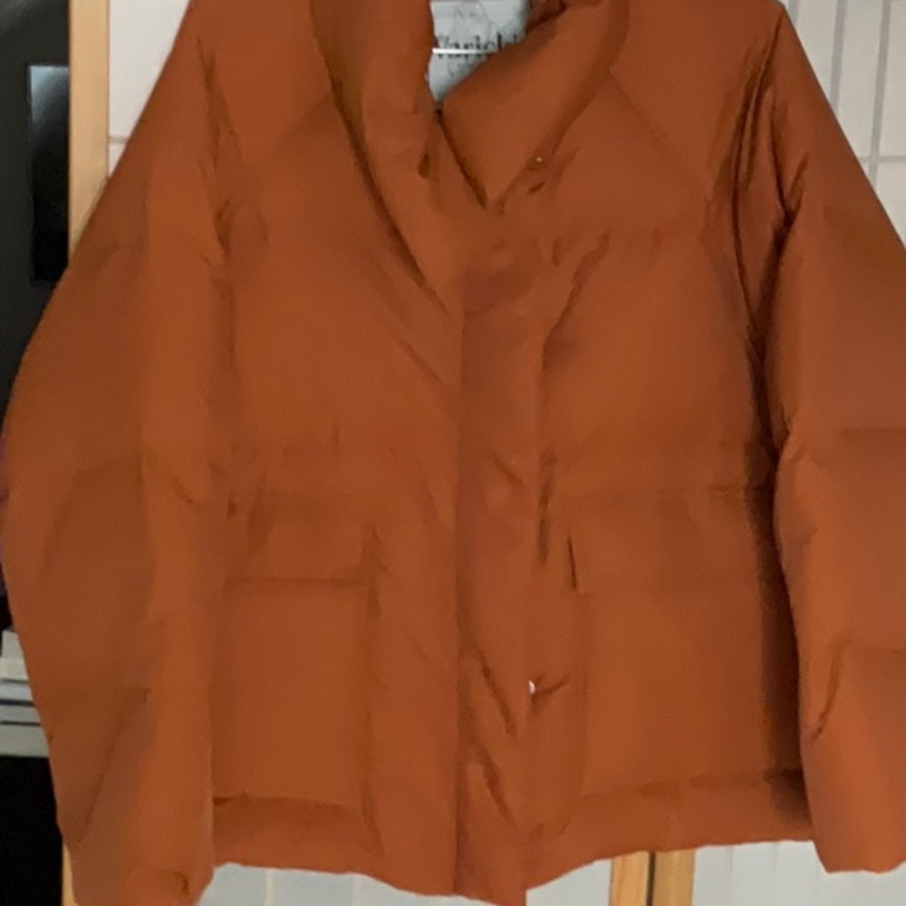 stunning apricot colored down jacket, modified shawl collar and wide sleeves.